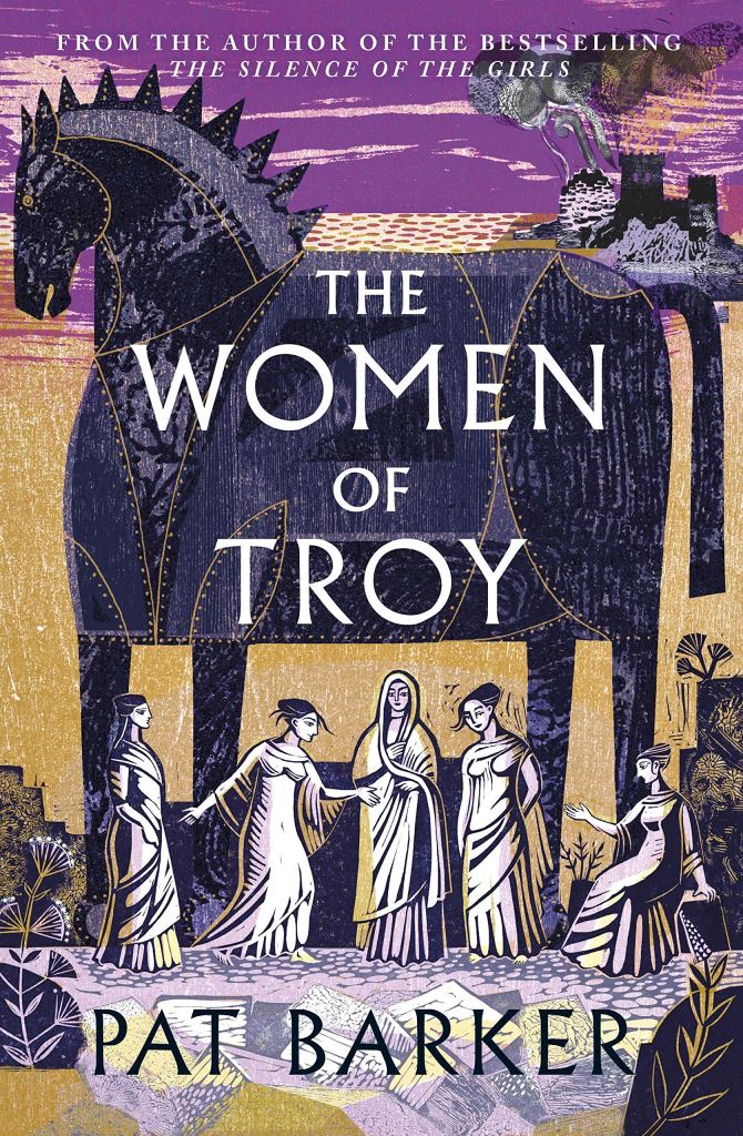 The cover for Pat Barker's The Women of Troy, which shows a large, stylized Trojan horse against a city wall. Beneath the horse, women, drawn in the Greek style, sit and stand. In the background, a city burns.