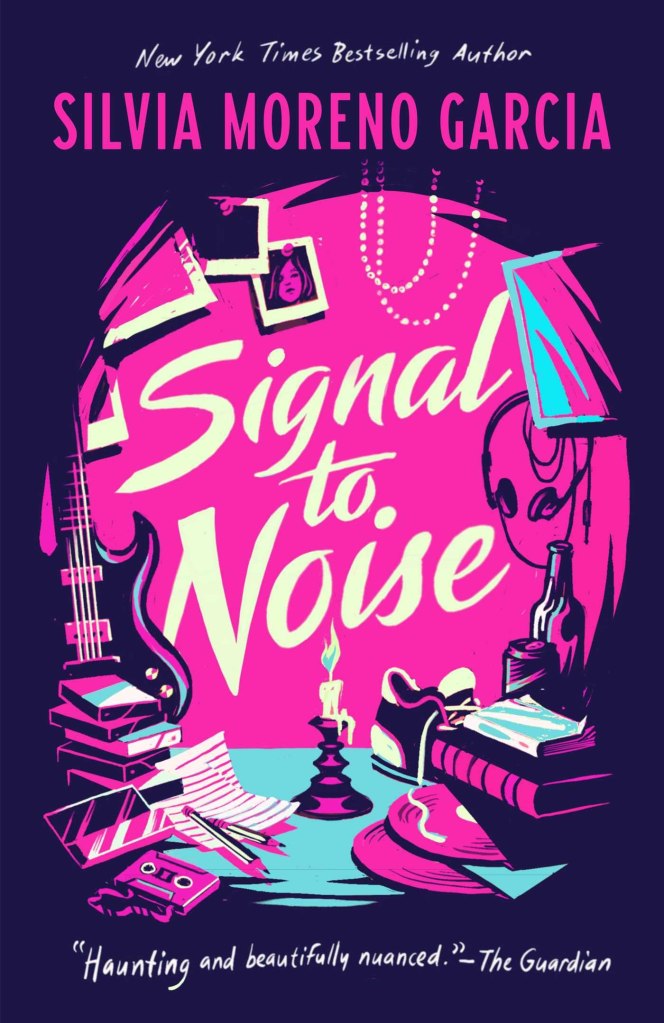 The cover to Silvia Moreno-Garcia's 2022 re-release of Signal to Noise, showing stacks of books, vinyl records and cassette tapes in the foreground with headphones hanging and an electric bass leaning to the side. In the center, a witchy candle burns.